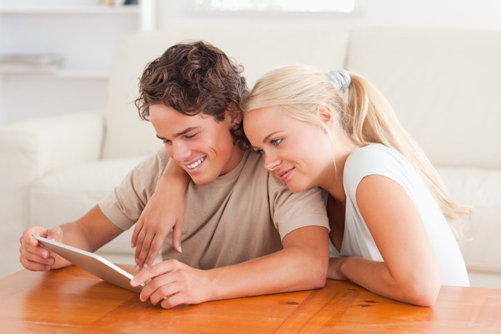 Young couple applying for a customized insurance policy online